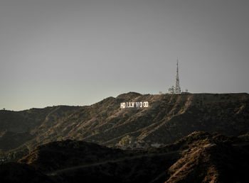 Building on mountain against clear sky