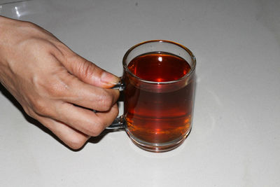 Close-up of hand holding drink