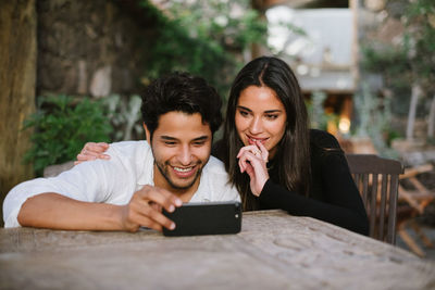 Young couple looking at camera