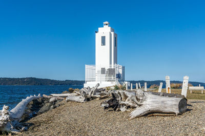 The lighthouse near the water at brown's point, washington.