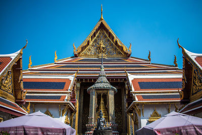 Low angle view of building against blue sky