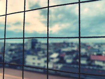 Full frame shot of building seen through window