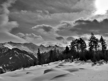 Scenic view of snow covered mountains against sky