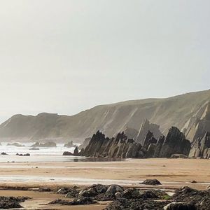 Scenic view of beach against sky