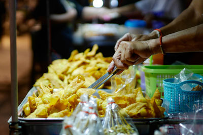 Midsection of man preparing food