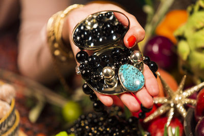 Close-up of hand holding fruit