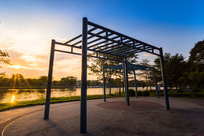 Ourdoor playground equipment in a sunset sky