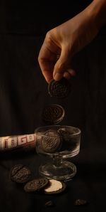 Close-up of hand holding coins