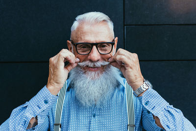 Close-up of senior hipster with white beard and mustache