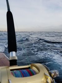 Sailboat sailing in sea against sky