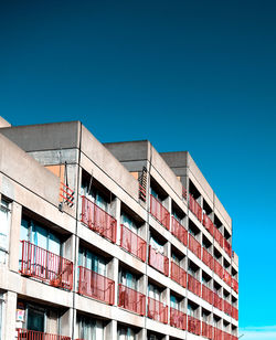 Low angle view of building against clear blue sky