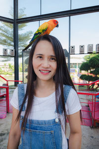 Portrait of smiling woman standing outdoors