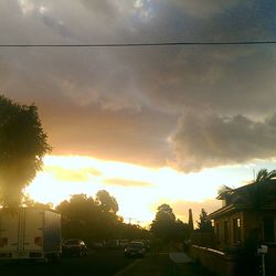 Car on road at sunset