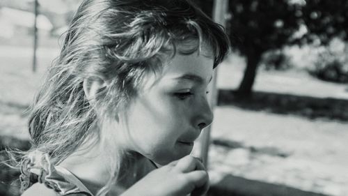 Close-up portrait of woman looking away