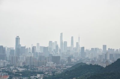 Buildings in city against sky