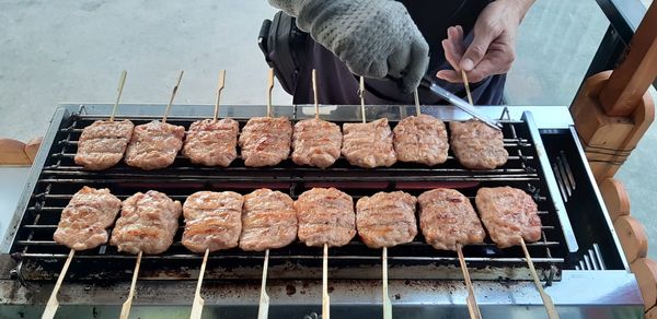 High angle view of meat on barbecue grill