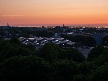 High angle view of buildings against sky during sunset