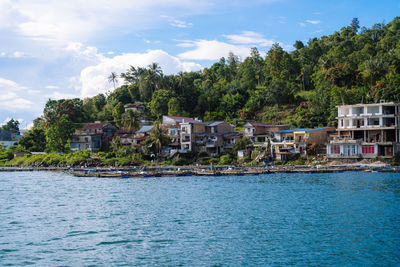 Scenic view of water front city in tigaras, simalungun, north sumatra, indonesia