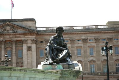 Statue of woman in city