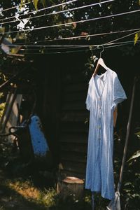 Clothes drying on wooden post in yard