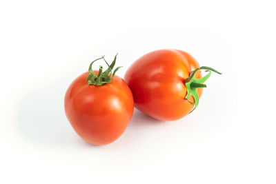 Close-up of tomatoes against white background