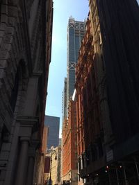 Low angle view of skyscrapers against sky