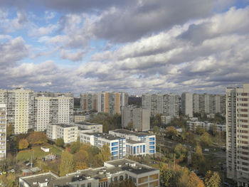 High angle view of buildings in city against sky