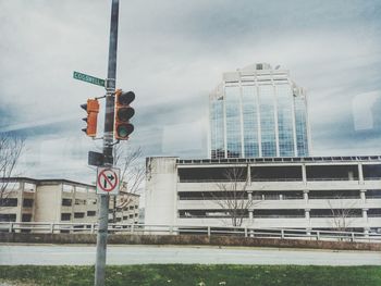 Modern building against cloudy sky