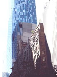 Low angle view of skyscraper against sky