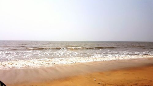 Scenic view of beach against clear sky