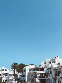 Low angle view of residential buildings against blue sky