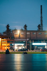 Illuminated buildings in city at night