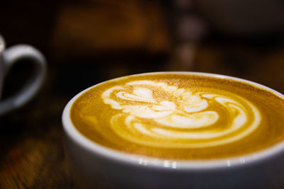 Close-up of cappuccino on table