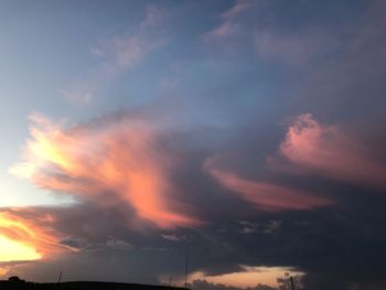 Low angle view of dramatic sky during sunset