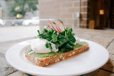 Close-up of healthy food in plate on table