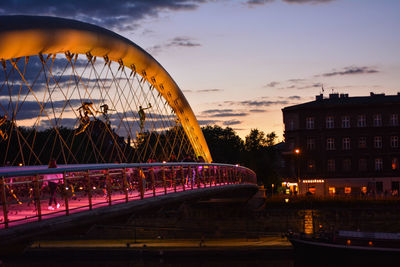 View of bridge in city during sunset