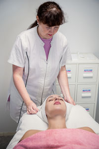 Doctor examining patient at clinic