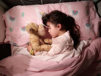 Girl relaxing on bed at home