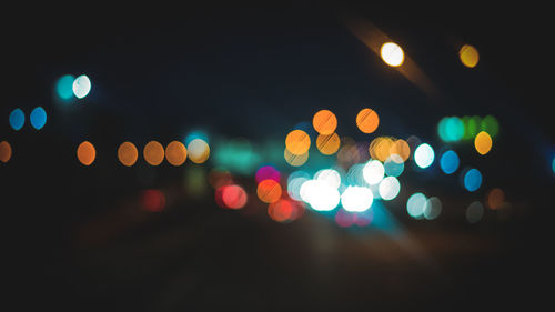 Defocused image of illuminated lights at night