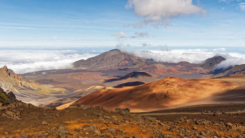 Wide volcanic landscape with lava fields in different colors, wide view, hawaii, maui, haleakala