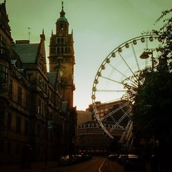 Low angle view of ferris wheel against sky