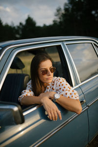 Woman sitting in car