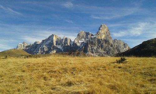 Scenic view of mountains against cloudy sky