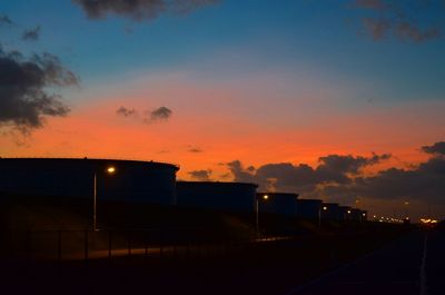 View of illuminated city at sunset