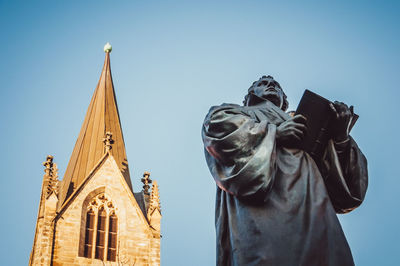 Low angle view of statue against clear sky