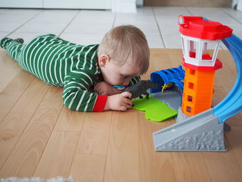 High angle view of cute baby toy on floor at home