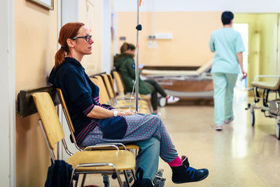 Woman sitting in hospital waiting room