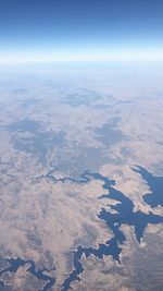 Aerial view of landscape and sea against sky