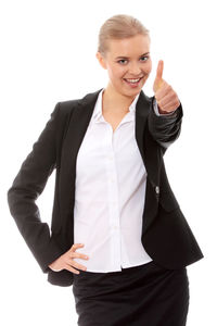 Portrait of a smiling young woman against white background