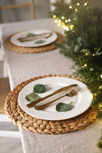 Decorated christmas plate. served christmas table closeup. holiday dinner preparation